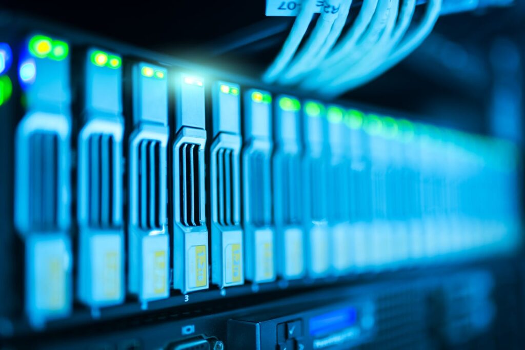 pexels-photo-1148820 Detailed image of a server rack with glowing lights in a modern data center.